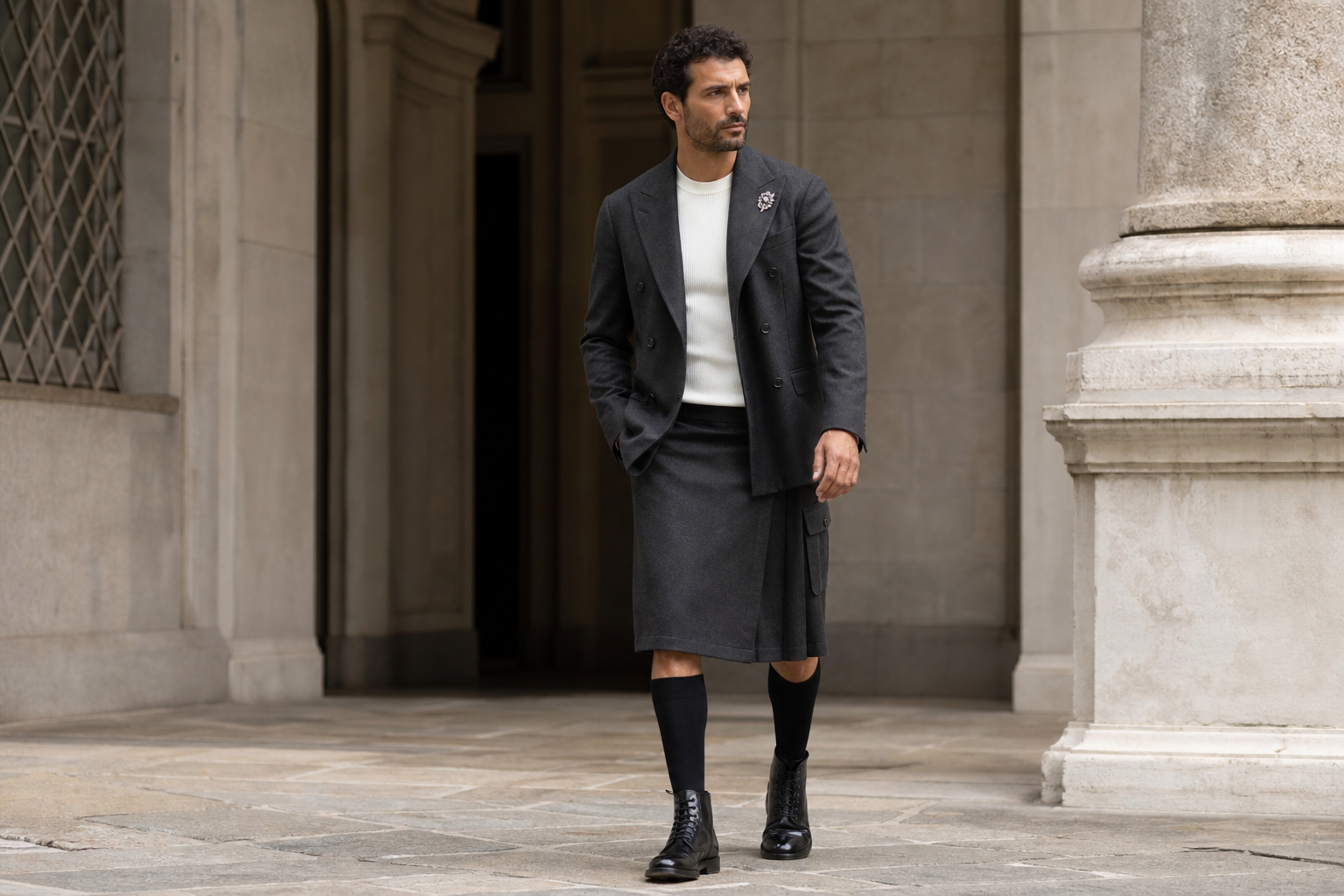 Milan look with silver brooch and knee-length charcoal men’s kilt.